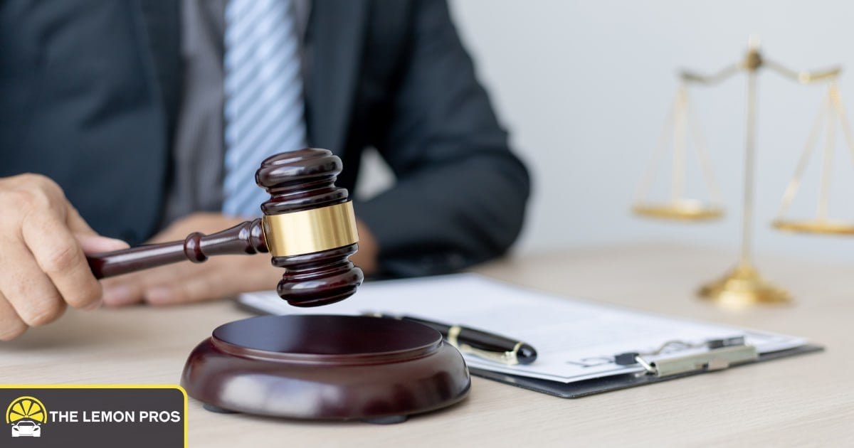 Filing a lawsuit under the Magnuson-Moss Warranty Act Gavel and scales of justice representing a Magnuson-Moss Warranty Act lawsuit